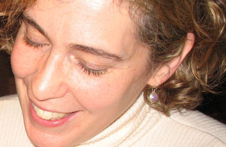 Headshot of writer Joelle Biele with her eyes closed.
